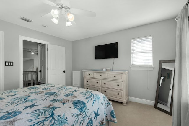 bedroom featuring ceiling fan and light colored carpet