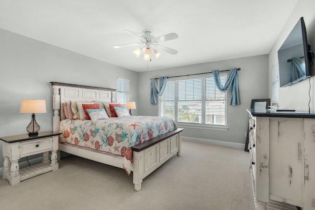 bedroom with ceiling fan and light colored carpet