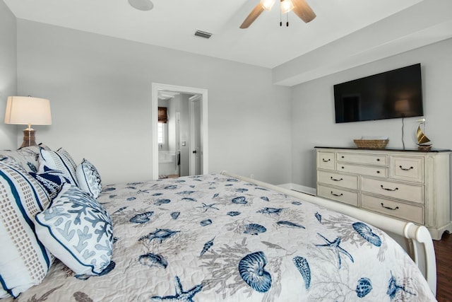 bedroom featuring ensuite bath, ceiling fan, and wood-type flooring