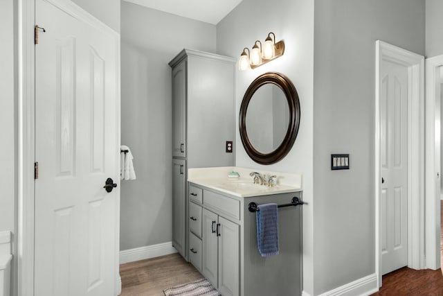 bathroom featuring vanity and hardwood / wood-style flooring