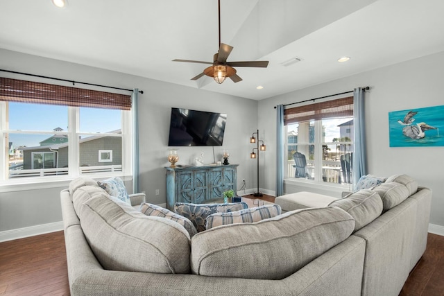 living room with vaulted ceiling, ceiling fan, and dark hardwood / wood-style floors