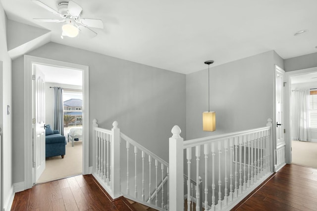 7646 Gulf Blvd, Navarre, FL 32566 - hall featuring an upstairs landing, hardwood / wood-style floors, and vaulted ceiling