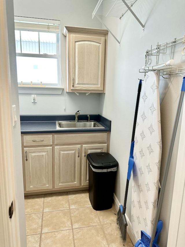 7646 Gulf Blvd, Navarre, FL 32566 - laundry room with a sink and light tile patterned flooring