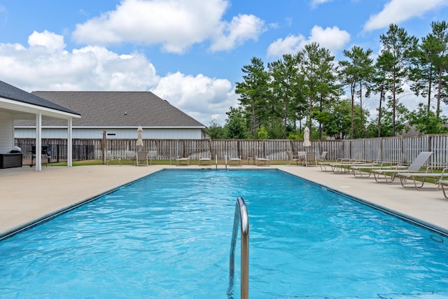 view of swimming pool featuring a patio area