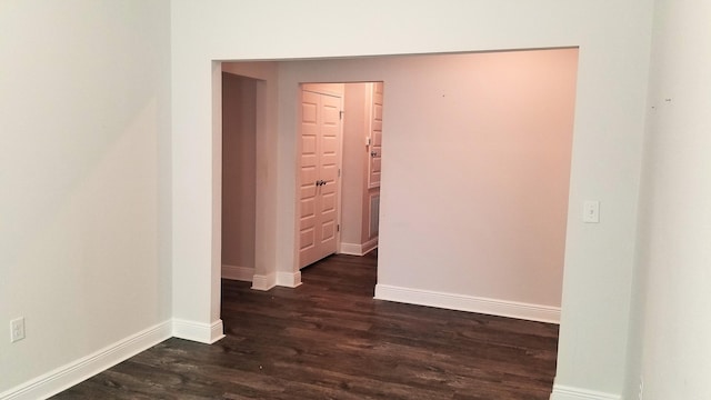 corridor featuring dark hardwood / wood-style floors