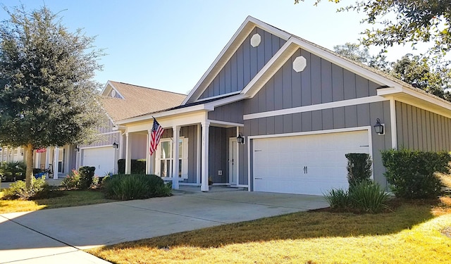 view of front of property with a front yard and a garage