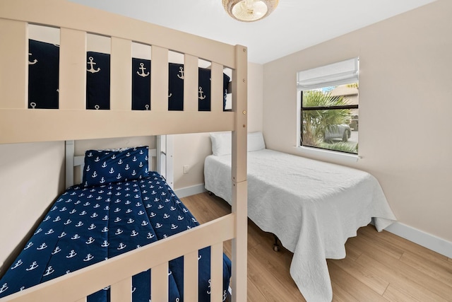 bedroom with hardwood / wood-style flooring