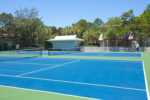 view of sport court with basketball hoop