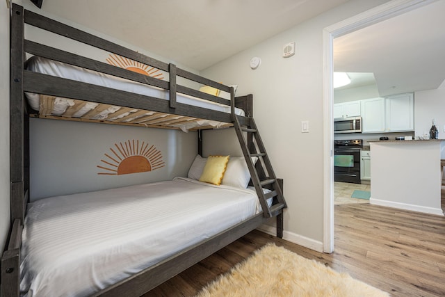 bedroom with light hardwood / wood-style floors