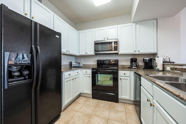 kitchen with black appliances, white cabinetry, sink, and dark stone counters