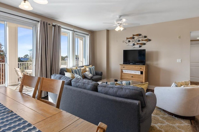 living room with ceiling fan and hardwood / wood-style floors