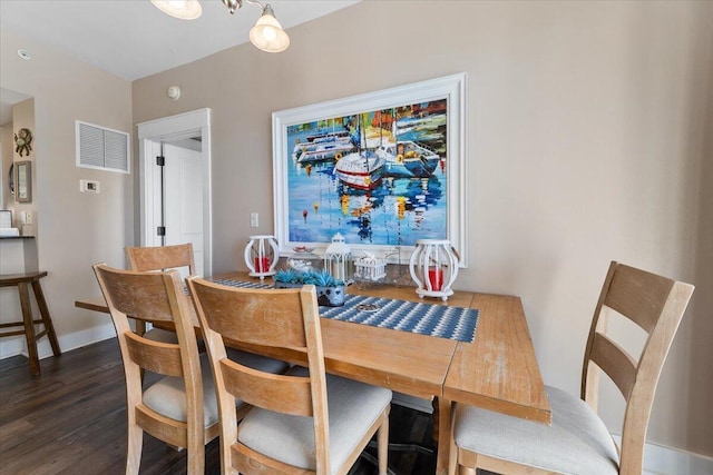 dining area featuring dark hardwood / wood-style floors