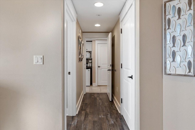 hallway featuring dark hardwood / wood-style floors