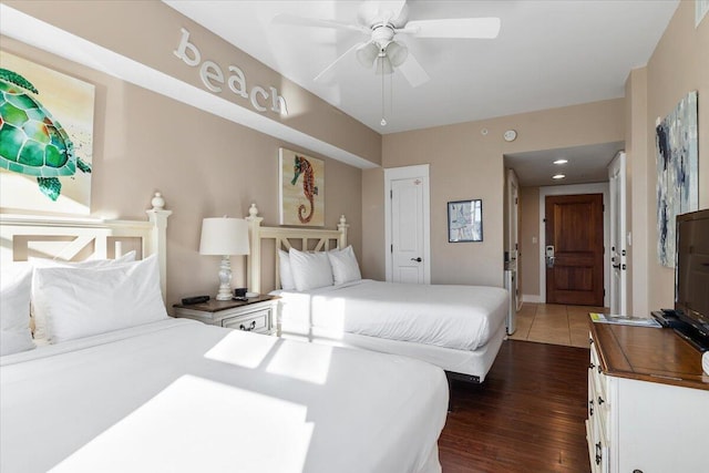 bedroom featuring dark wood-type flooring and ceiling fan