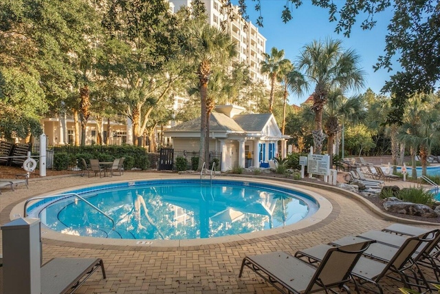 view of swimming pool featuring a patio area