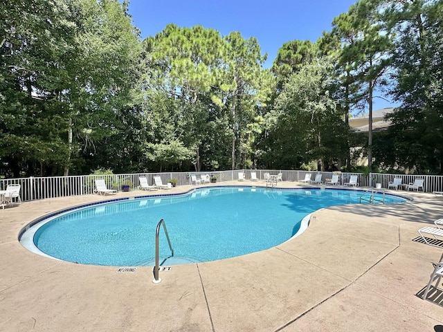 view of swimming pool featuring a patio