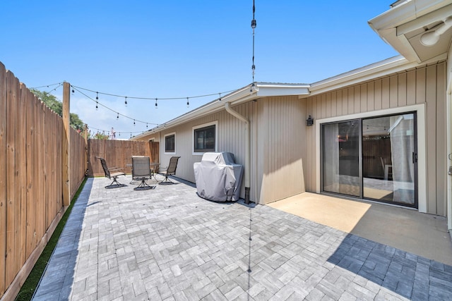 view of patio / terrace with a grill and central air condition unit