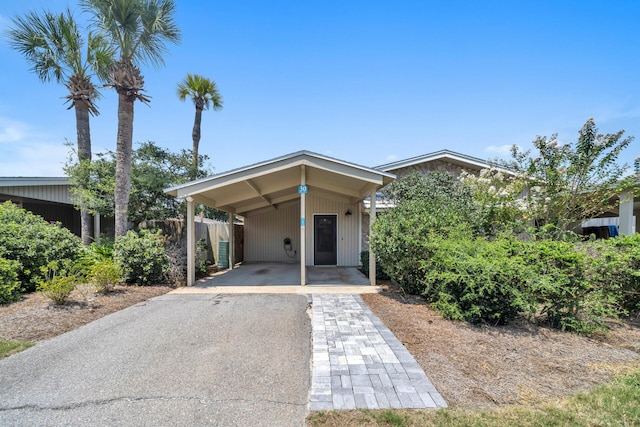 view of front of property featuring a carport