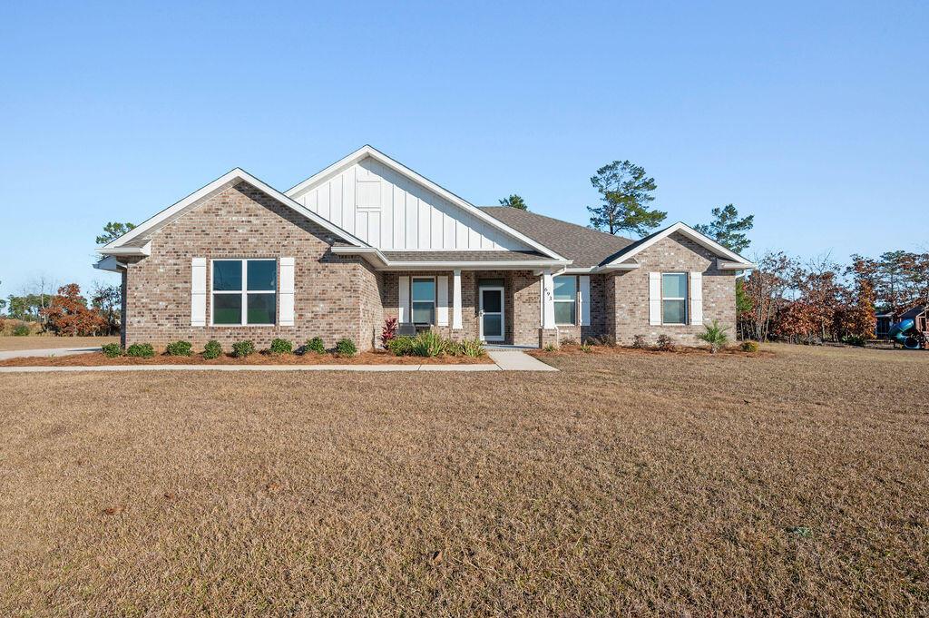 craftsman inspired home with a front yard