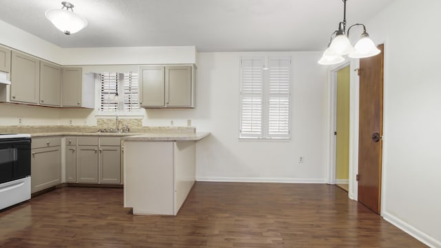 kitchen featuring gray cabinets, light countertops, a sink, and electric range oven