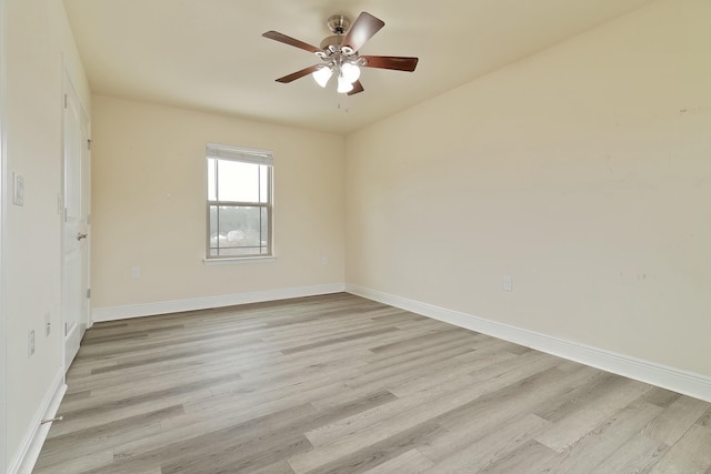 empty room featuring ceiling fan and light hardwood / wood-style flooring