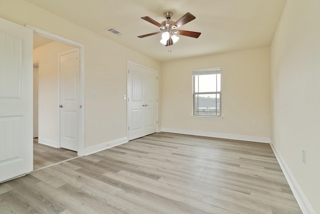 unfurnished bedroom featuring ceiling fan and light hardwood / wood-style floors