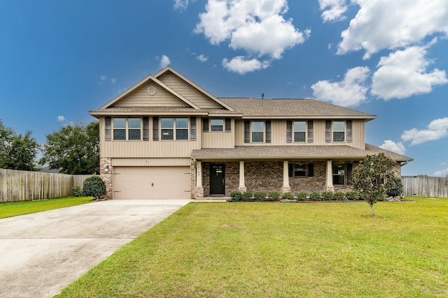 view of front of property featuring a garage and a front yard