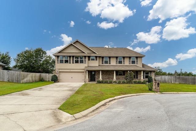 craftsman house featuring a garage and a front yard