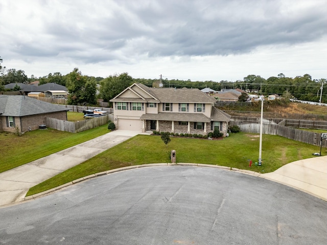 view of front of house with a front lawn and a garage