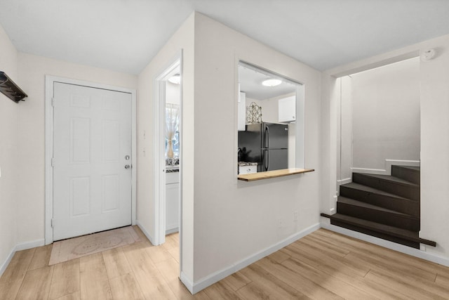 foyer entrance featuring light hardwood / wood-style flooring