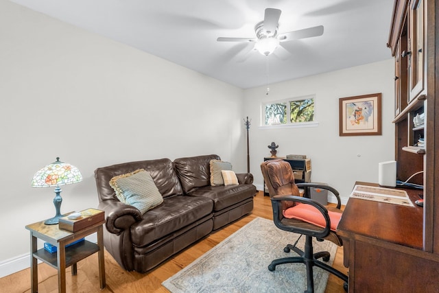 home office featuring ceiling fan and light hardwood / wood-style floors