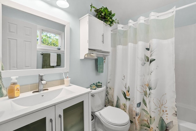 full bathroom with vanity, toilet, and shower / bathtub combination with curtain