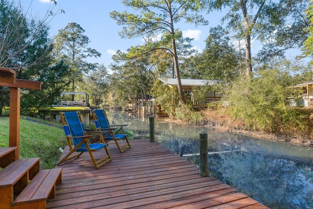 dock area with a water view