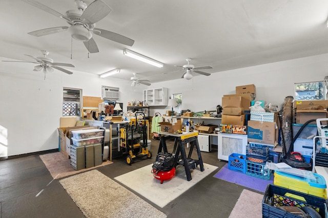 garage with a workshop area and an AC wall unit