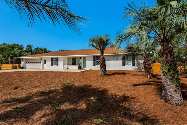 ranch-style house featuring a garage