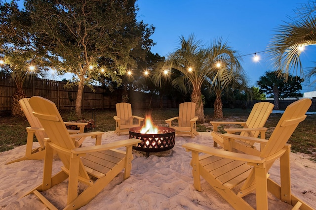 patio terrace at dusk with an outdoor fire pit