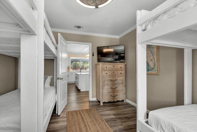 bedroom featuring dark hardwood / wood-style flooring and ornamental molding