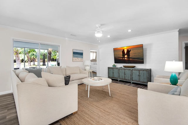 living room with ceiling fan, wood-type flooring, and ornamental molding