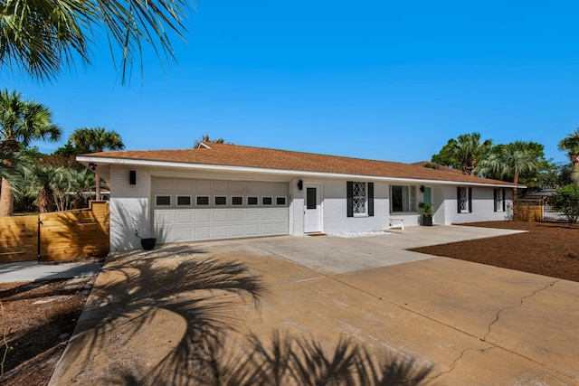 single story home featuring a garage