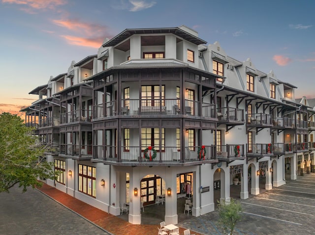 view of outdoor building at dusk