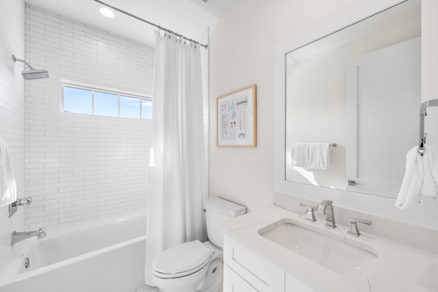 full bathroom featuring shower / bath combination with curtain, vanity, and toilet