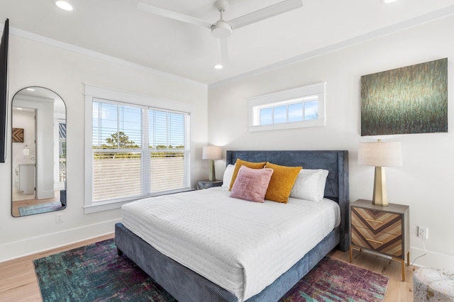 bedroom featuring wood-type flooring, ceiling fan, and ornamental molding