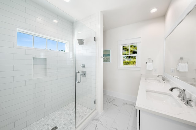 bathroom featuring vanity and a shower with door