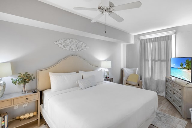 bedroom with light wood-type flooring and ceiling fan