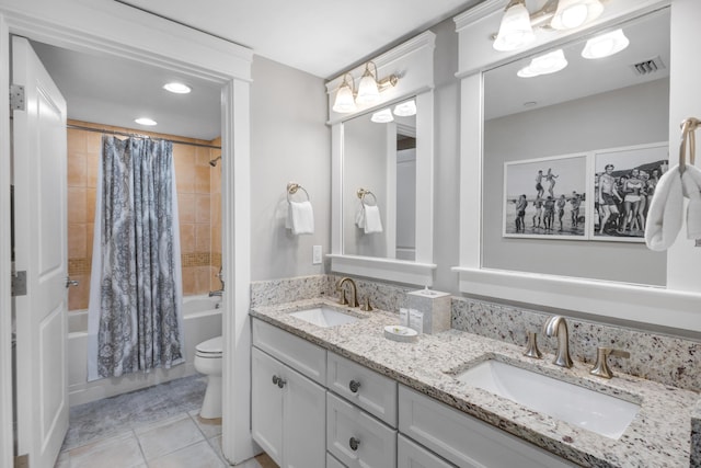 full bathroom featuring tile patterned flooring, vanity, shower / tub combo, and toilet