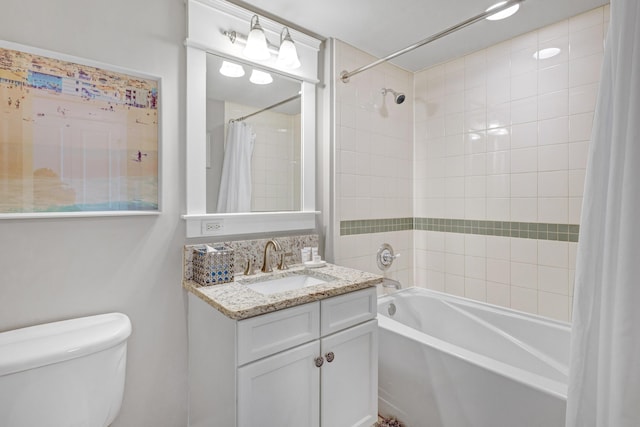 full bathroom featuring shower / tub combo, vanity, and toilet