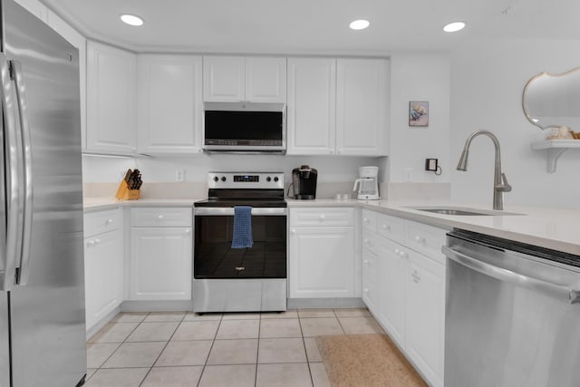 kitchen featuring white cabinets, sink, and stainless steel appliances