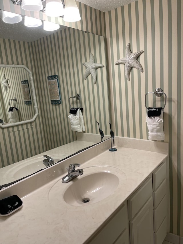 bathroom featuring vanity and a textured ceiling