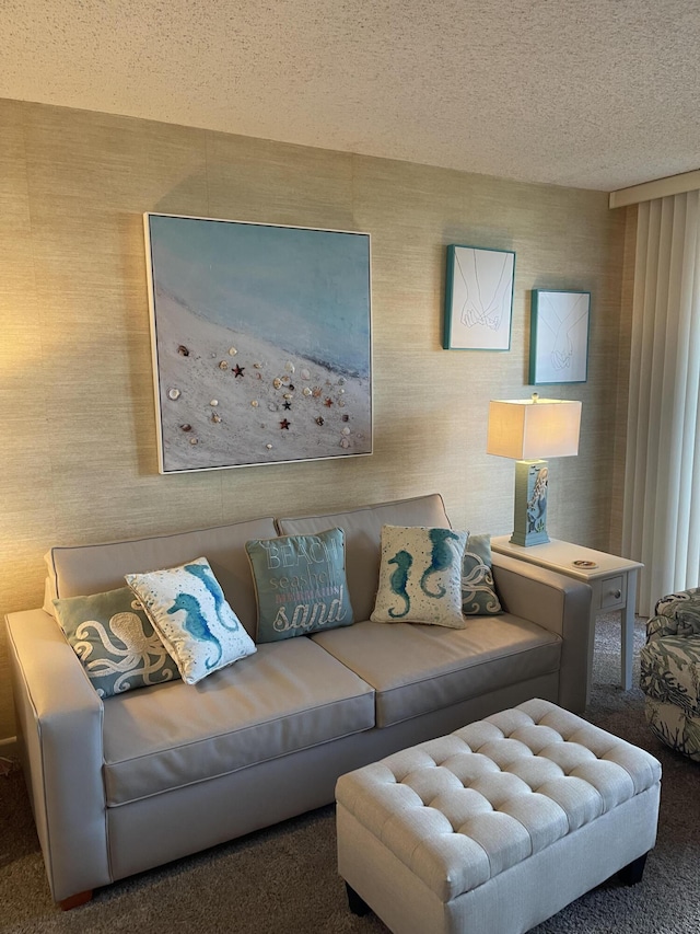 carpeted living room featuring a textured ceiling