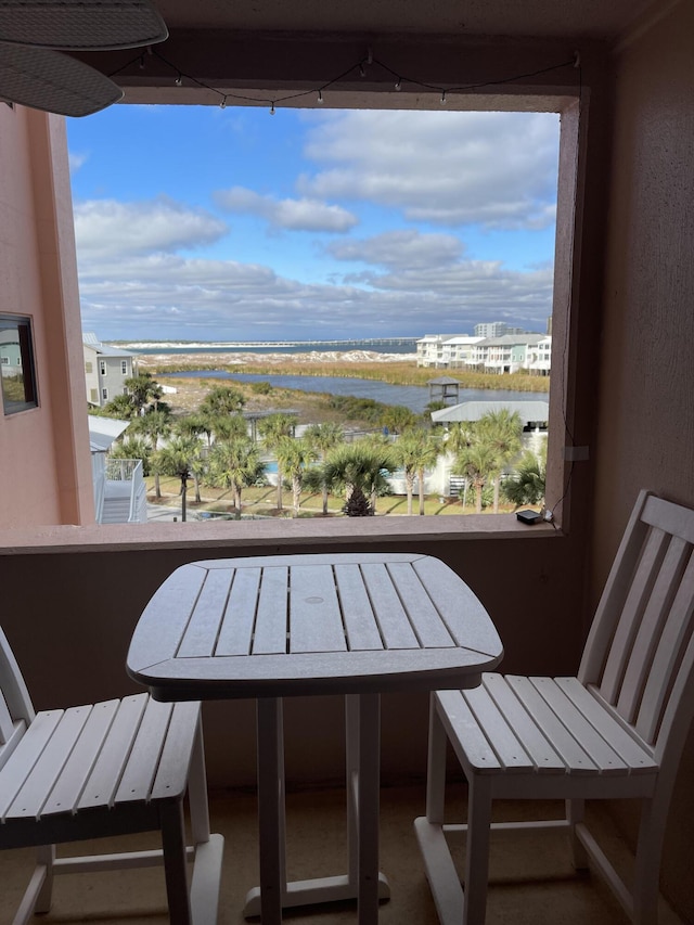 balcony featuring a water view